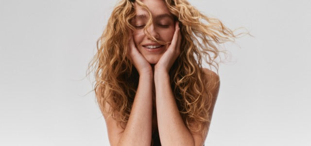 Woman with blonde wavy hair