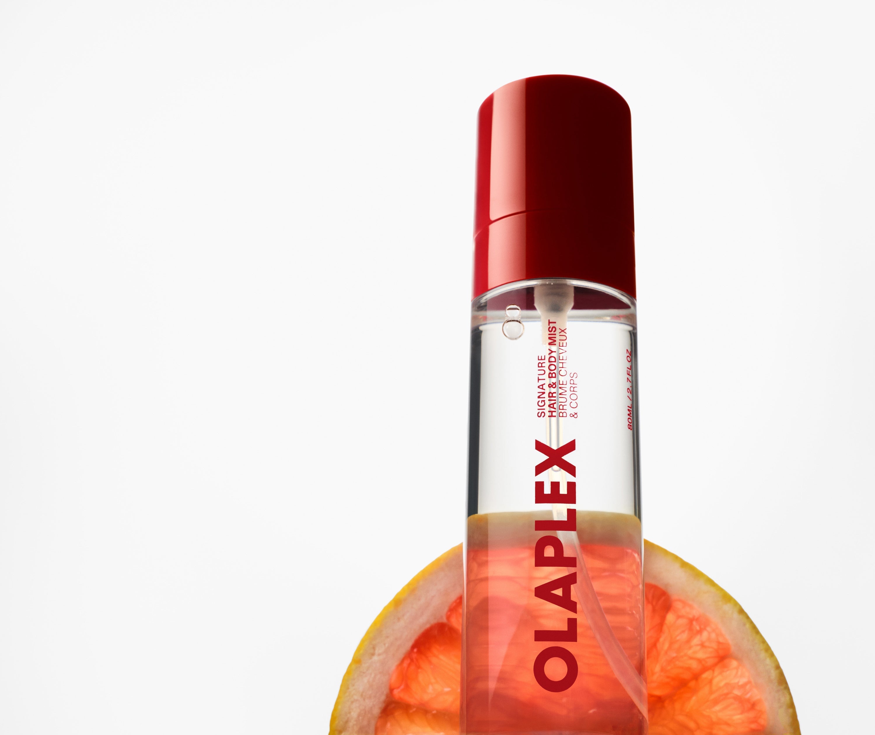 OLAPLEX Signature Hair & Body Mist bottle with grapefruit.