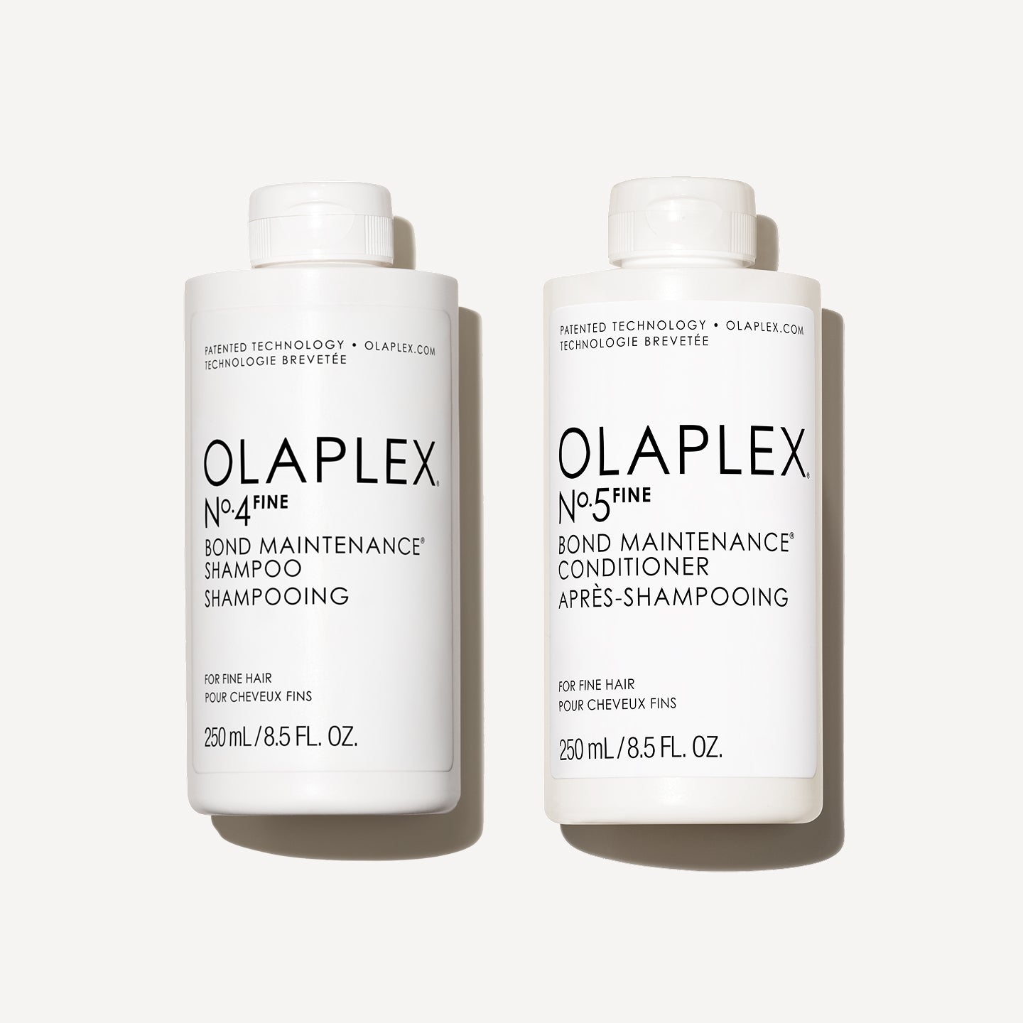 Olaplex No.4FINE Shampoo and No.5FINE Conditioner bottles on a white background