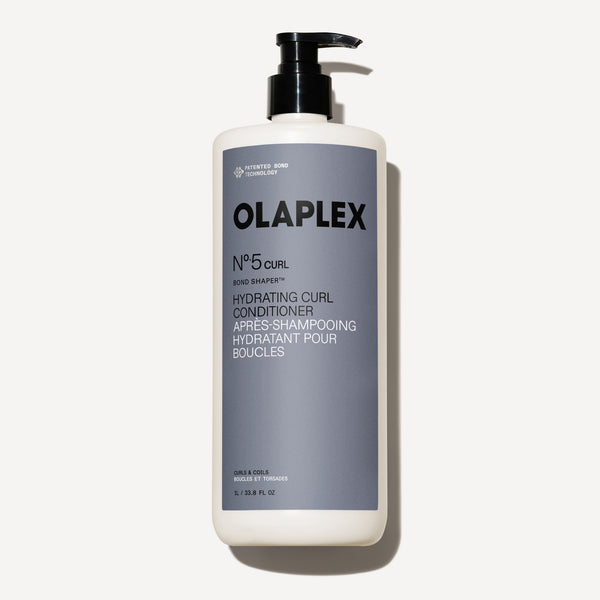 hover 

A thick, creamy white swatch of OLAPLEX Nº.5CURL Hydrating Curl Conditioner showing a smooth, rich texture on a light gray background. - alternate view